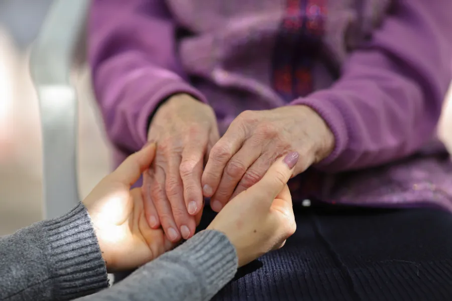 OLder hands with younger hands
